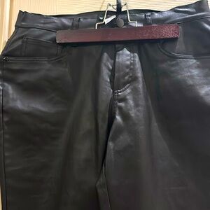 Never worn leather look pants look fitted with a stretch in them